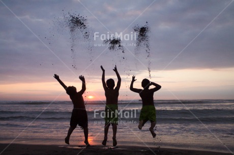 Fair Trade Photo Activity, Beach, Colour image, Emotions, Evening, Friendship, Group of boys, Happiness, Horizontal, Jumping, Outdoor, People, Peru, Playing, Shooting style, Silhouette, South America, Summer, Sunset, Together