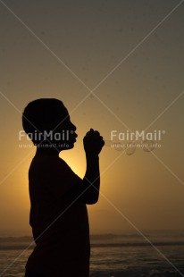 Fair Trade Photo Activity, Colour image, Dreaming, Evening, One boy, Outdoor, People, Peru, Playing, Soapbubble, South America, Spirituality, Sunset, Vertical