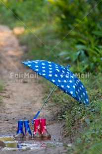 Fair Trade Photo Activity, Boot, Colour image, Friendship, Outdoor, Peru, Playing, Rain, South America, Star, Summer, Together, Umbrella, Vertical, Water