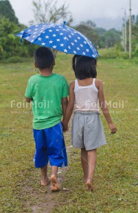 Fair Trade Photo Activity, Colour image, Cute, Friendship, Grass, Horizontal, People, Peru, Rural, South America, Together, Two children, Umbrella, Vertical, Walking