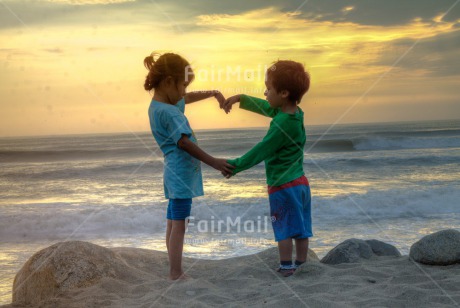 Fair Trade Photo Balance, Beach, Colour image, Cooperation, Evening, Heart, Horizontal, Love, Outdoor, Peace, People, Sea, Seasons, Sky, Spirituality, Summer, Together, Two children, Wellness, Yoga, Youth