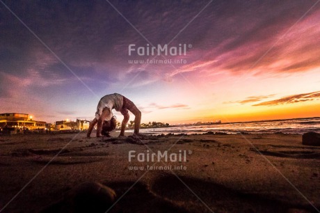 Fair Trade Photo Balance, Beach, Colour image, Evening, Horizontal, One girl, Outdoor, Peace, People, Sea, Seasons, Sky, Spirituality, Summer, Wellness, Yoga, Youth