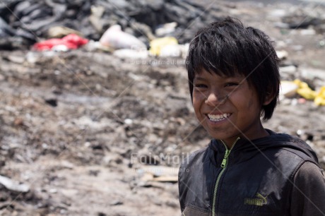 Fair Trade Photo Activity, Colour image, Garbage belt, Horizontal, Looking at camera, One boy, People, Peru, Portrait halfbody, Poverty, Smiling, South America