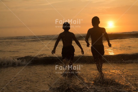 Fair Trade Photo Activity, Beach, Colour image, Friendship, Horizontal, People, Peru, Playing, Running, Sea, Shooting style, Silhouette, South America, Sunset, Two boys