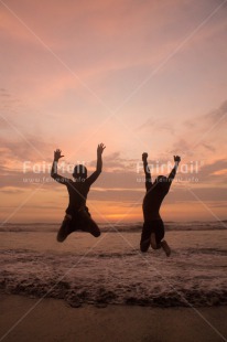 Fair Trade Photo Activity, Beach, Colour image, Friendship, Jumping, People, Peru, Playing, Sea, Shooting style, Silhouette, South America, Sunset, Two boys, Vertical