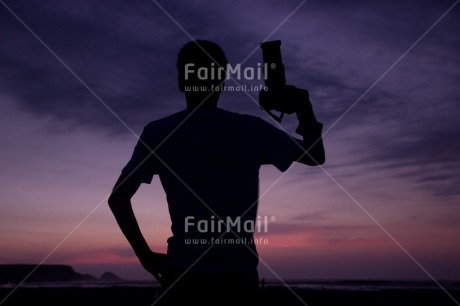 Fair Trade Photo Camera, Colour image, Horizontal, One boy, People, Peru, Shooting style, Silhouette, Sky, South America, Sunset