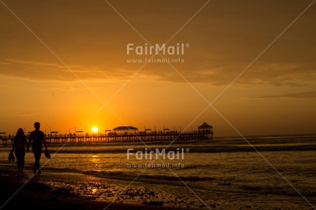 Fair Trade Photo Activity, Beach, Bridge, Coastal, Colour image, Couple, Evening, Holding hands, Horizontal, Huanchaco, Love, Ocean, Outdoor, People, Peru, Sea, Shooting style, Silhouette, South America, Sunset, Two people, Two persons, Walking, Water