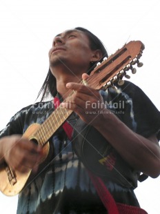 Fair Trade Photo Activity, Colour image, Ethnic-folklore, Guitar, Latin, Looking away, Music, One man, People, Peru, Portrait halfbody, South America, Vertical