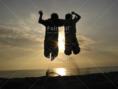Fair Trade Photo 15-20 years, Backlit, Beach, Clouds, Colour image, Cooperation, Emotions, Evening, Friendship, Happiness, Horizontal, Nature, Outdoor, People, Peru, Silhouette, Sky, South America, Sun, Sunset, Two boys, Water