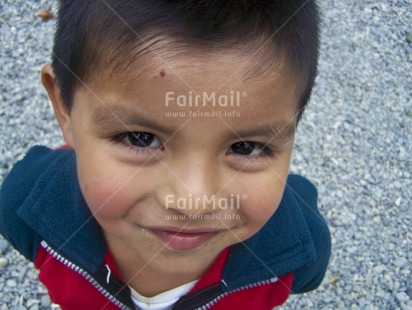 Fair Trade Photo 0-5 years, Activity, Casual clothing, Clothing, Colour image, Cute, Day, High angle view, Horizontal, Latin, Looking at camera, Multi-coloured, One boy, Outdoor, People, Peru, Portrait headshot, Smile, Smiling, South America, Street