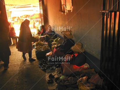 Fair Trade Photo Activity, Backlit, Colour image, Dailylife, Entrepreneurship, Ethnic-folklore, Food and alimentation, Horizontal, Market, Multi-coloured, People, Peru, Portrait fullbody, Rural, Saleswoman, Selling, Silhouette, Sombrero, South America, Streetlife, Working