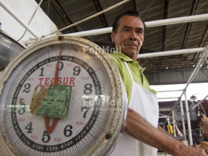 Fair Trade Photo Activity, Colour image, Day, Entrepreneurship, Horizontal, Indoor, Latin, Looking at camera, Low angle view, Market, One man, People, Peru, Proud, Selling, South America, Weighing