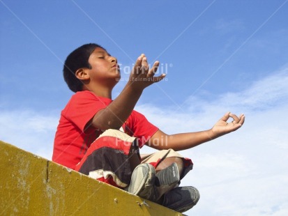 Fair Trade Photo 10-15 years, Activity, Colour image, Horizontal, Latin, One boy, Outdoor, Peace, People, Peru, Portrait fullbody, Red, Relaxing, Sitting, South America, Spirituality, Wellness, Yellow, Yoga