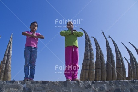 Fair Trade Photo 10-15 years, Activity, Boat, Casual clothing, Clothing, Colour image, Day, Green, Horizontal, Latin, Looking at camera, Outdoor, People, Peru, Pink, Sky, Smiling, South America, Two girls, Yoga