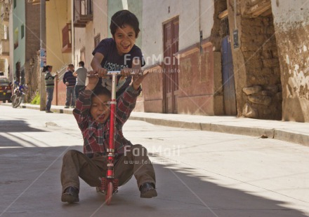 Fair Trade Photo 5 -10 years, Activity, Bicycle, Dailylife, Day, Emotions, Friendship, Happiness, Horizontal, Latin, Outdoor, People, Peru, Playing, Rural, South America, Streetlife, Transport, Two boys