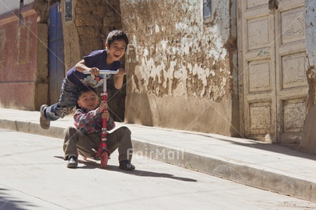 Fair Trade Photo 5 -10 years, Activity, Bicycle, Dailylife, Day, Emotions, Friendship, Happiness, Horizontal, Latin, Outdoor, People, Peru, Playing, Rural, South America, Streetlife, Transport, Two boys