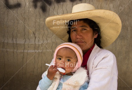 Fair Trade Photo Activity, Colour image, Eating, Hat, Horizontal, Latin, Looking at camera, Mother, One baby, One woman, People, Peru, Portrait halfbody, Sombrero, South America
