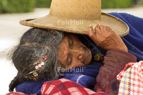 Fair Trade Photo 65-70 years, Activity, Colour image, Day, Horizontal, Latin, Old age, One woman, Outdoor, People, Peru, Relaxing, Sleeping, Sombrero, South America, Streetlife