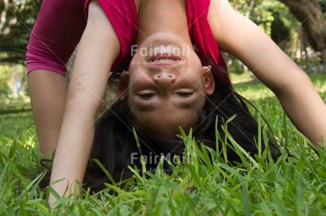Fair Trade Photo Activity, Colour image, Day, Grass, Horizontal, Looking at camera, One girl, Outdoor, People, Peru, South America, Yoga