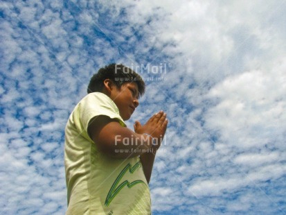 Fair Trade Photo 10-15 years, Activity, Colour image, Horizontal, Latin, Low angle view, Meditating, Multi-coloured, One boy, Outdoor, People, Peru, Portrait halfbody, Praying, Sky, South America, Spirituality, Yoga