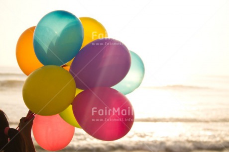 Fair Trade Photo Activity, Balloon, Beach, Birthday, Celebrating, Colour image, Day, Gift, Holding, Horizontal, Multi-coloured, Ocean, Outdoor, Peru, Sand, Sea, South America, Water