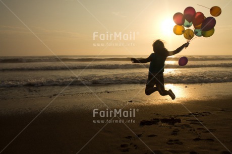 Fair Trade Photo Activity, Balloon, Beach, Birthday, Celebrating, Child, Colour image, Day, Emotions, Evening, Friendship, Girl, Happiness, Holding, Holiday, Horizontal, Jumping, Multi-coloured, Ocean, Outdoor, People, Peru, Sand, Sea, Seasons, Sister, South America, Summer, Sunset, Water