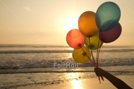 Fair Trade Photo Activity, Balloon, Beach, Birthday, Celebrating, Colour image, Day, Evening, Gift, Holding, Horizontal, Multi-coloured, Ocean, Outdoor, Peru, Sea, South America, Sunset, Water