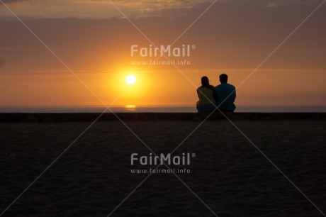 Fair Trade Photo Activity, Backlit, Beach, Blue, Care, Colour image, Condolence-Sympathy, Couple, Evening, Friendship, Horizontal, Light, Love, One man, One woman, Outdoor, People, Peru, Romantic, Scenic, Sea, Silhouette, Sitting, Sky, South America, Summer, Sunset, Together, Travel, Two people, Water