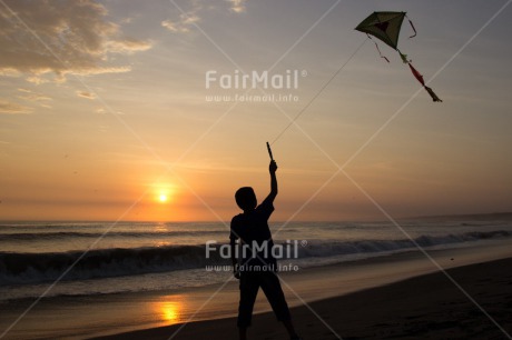 Fair Trade Photo Activity, Backlit, Beach, Colour image, Evening, Freedom, Heart, Kite, Love, One boy, Outdoor, People, Peru, Playing, Sea, Silhouette, Sky, South America, Summer, Sunset, Water
