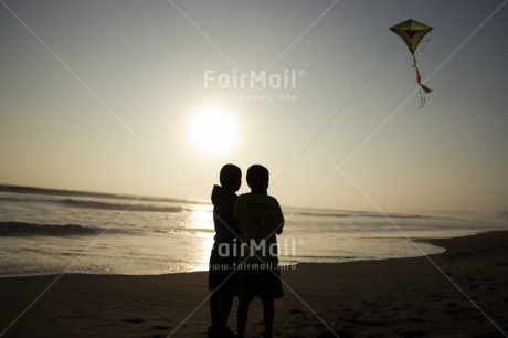 Fair Trade Photo Activity, Backlit, Beach, Colour image, Evening, Freedom, Friendship, Heart, Kite, Love, Outdoor, People, Peru, Playing, Sea, Silhouette, Sky, South America, Summer, Sunset, Two boys, Water