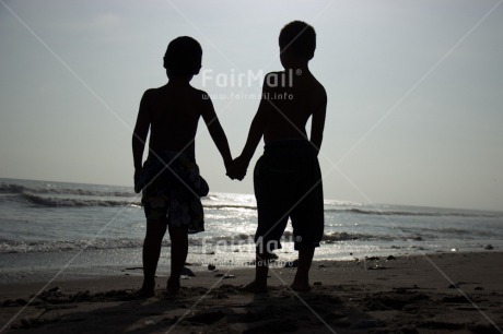 Fair Trade Photo Activity, Backlit, Beach, Colour image, Cooperation, Evening, Friendship, Holding hands, Outdoor, People, Peru, Sand, Silhouette, South America, Summer, Together, Two boys