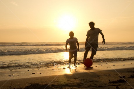 Fair Trade Photo Activity, Ball, Beach, Brother, Colour image, Evening, Friendship, Horizontal, Ocean, Outdoor, People, Peru, Playing, Running, Sea, Shooting style, Silhouette, Soccer, South America, Sunset