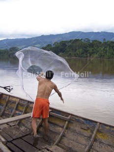 Fair Trade Photo Agriculture, Boat, Casual clothing, Clothing, Colour image, Entrepreneurship, Fisheries, Fishing, One man, People, Peru, Rural, Scenic, South America, Travel, Vertical, Water, Work