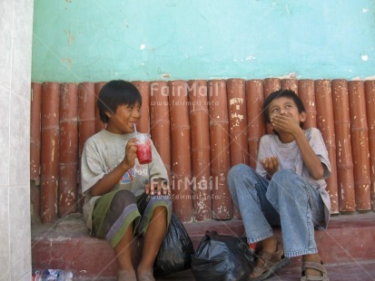 Fair Trade Photo 10-15 years, Activity, Casual clothing, Clothing, Colour image, Dailylife, Drinking, Emotions, Friendship, Happiness, Horizontal, Latin, People, Peru, Relaxing, Sitting, Smile, Smiling, South America, Street, Streetlife, Talking, Two children