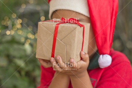Fair Trade Photo Activity, Adjective, Boy, Celebrating, Child, Christmas, Christmas decoration, Christmas hat, Colour, Gift, Horizontal, Light, Nature, Object, People, Present, Red, Santaclaus