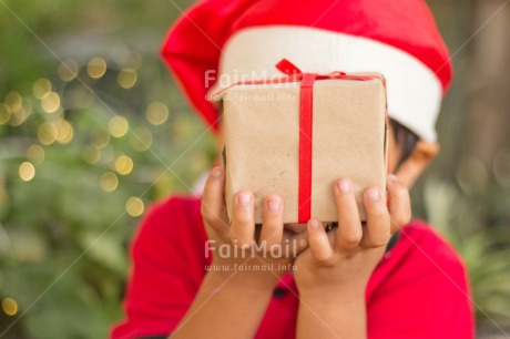 Fair Trade Photo Activity, Adjective, Boy, Celebrating, Child, Christmas, Christmas decoration, Christmas hat, Colour, Gift, Horizontal, Light, Nature, Object, People, Present, Red, Santaclaus