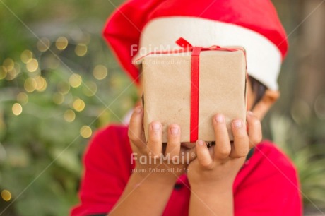 Fair Trade Photo Activity, Adjective, Boy, Celebrating, Child, Christmas, Christmas decoration, Christmas hat, Colour, Gift, Horizontal, Light, Nature, Object, People, Present, Red, Santaclaus