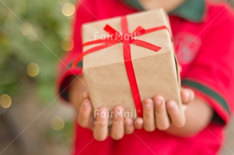 Fair Trade Photo Activity, Adjective, Boy, Celebrating, Child, Christmas, Christmas decoration, Christmas hat, Colour, Gift, Horizontal, Light, Nature, Object, People, Present, Red, Santaclaus