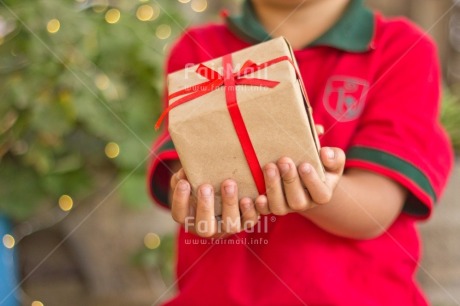 Fair Trade Photo Activity, Adjective, Boy, Celebrating, Child, Christmas, Christmas decoration, Christmas hat, Colour, Gift, Horizontal, Light, Nature, Object, People, Present, Red, Santaclaus