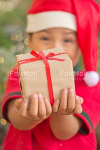 Fair Trade Photo Activity, Adjective, Boy, Celebrating, Child, Christmas, Christmas decoration, Christmas hat, Colour, Gift, Light, Nature, Object, People, Present, Red, Santaclaus, Vertical