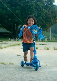 Fair Trade Photo Activity, Bicycle, Colour image, Day, One child, Outdoor, People, Peru, Playing, Rural, Smiling, South America, Sport, Transport, Vertical