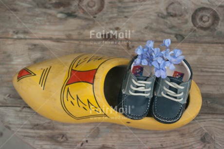 Fair Trade Photo Birth, Boy, Closeup, Colour image, Ethnic-folklore, Flower, Horizontal, Netherlands, New baby, People, Peru, Shoe, Shooting style, South America, Wood
