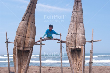 Fair Trade Photo Beach, Colour image, Fishing boat, Health, Horizontal, One boy, Outdoor, Peace, People, Peru, Sea, South America, Wellness, Yoga