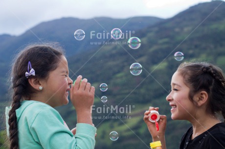 Fair Trade Photo Activity, Colour image, Dailylife, Emotions, Friendship, Happiness, Horizontal, Outdoor, People, Peru, Playing, Soapbubble, South America, Summer, Together, Two girls