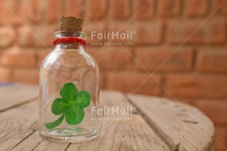 Fair Trade Photo Bottle, Brick, Clover, Colour image, Cork, Desk, Exams, Glass, Good luck, Green, Horizontal, Peru, School, South America, Success, Table, Wood