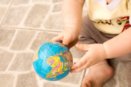 Fair Trade Photo 0-5 years, Activity, Baby, Caucasian, Colour image, Globe, Hands, Holding, Holiday, Horizontal, People, Peru, Sitting, South America, Travel, Travelling, World