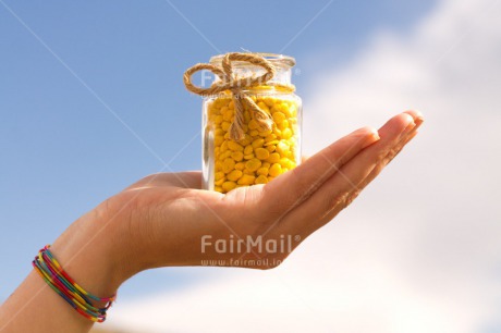 Fair Trade Photo Colour image, Day, Gift, Glass, Hand, Horizontal, Outdoor, Peru, Ribbon, Rope, South America, Sweets, Thank you, Yellow