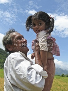 Fair Trade Photo Activity, Care, Carrying, Colour image, Emotions, Family, Happiness, Laughing, Looking at camera, Love, Multi-coloured, Nature, Old age, One girl, One man, Outdoor, People, Peru, Portrait halfbody, Proud, Rural, South America, Vertical