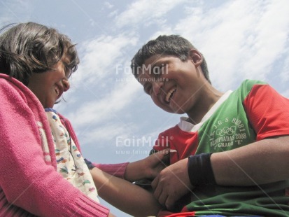 Fair Trade Photo Activity, Care, Colour image, Day, Family, Friendship, Horizontal, Love, Low angle view, One boy, One girl, Outdoor, People, Peru, Playing, Sky, Smiling, South America, Together, Two children, Warmth