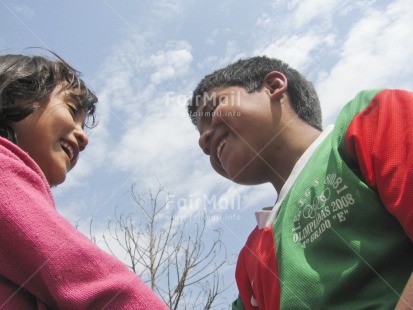 Fair Trade Photo Activity, Care, Colour image, Day, Family, Friendship, Horizontal, Love, Low angle view, One boy, One girl, Outdoor, People, Peru, Playing, Sky, Smiling, South America, Together, Tree, Two children, Warmth